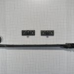 Raamuitzetter met krul, ijzer zwart