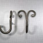 Kapstokhaak enkel, krul, ijzer geroest