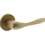 Intersteel deurklink Banaan met rozet ø49x7mm verdekt messing getrommeld