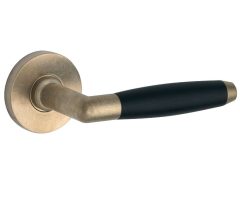 Deurklink op geveerd rozet Ton ebben/Vivo messing antiek