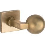 Knopkruk op geveerd rozet verdekt Bauhaus messing antiek