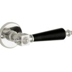 Deurklink op ongeveerd rozet Roman bakeliet/facet glans nikkel