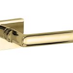 Deurklink op geveerd rozet verdekt Padania messing ongelakt